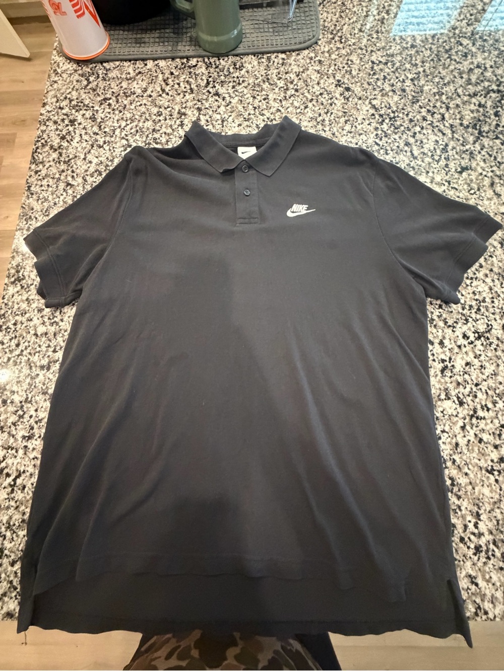Nike Men’s Black Polo with White Swoosh Logo